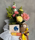 Bouquet of flowers with a Lula product and plush toy on a gray background